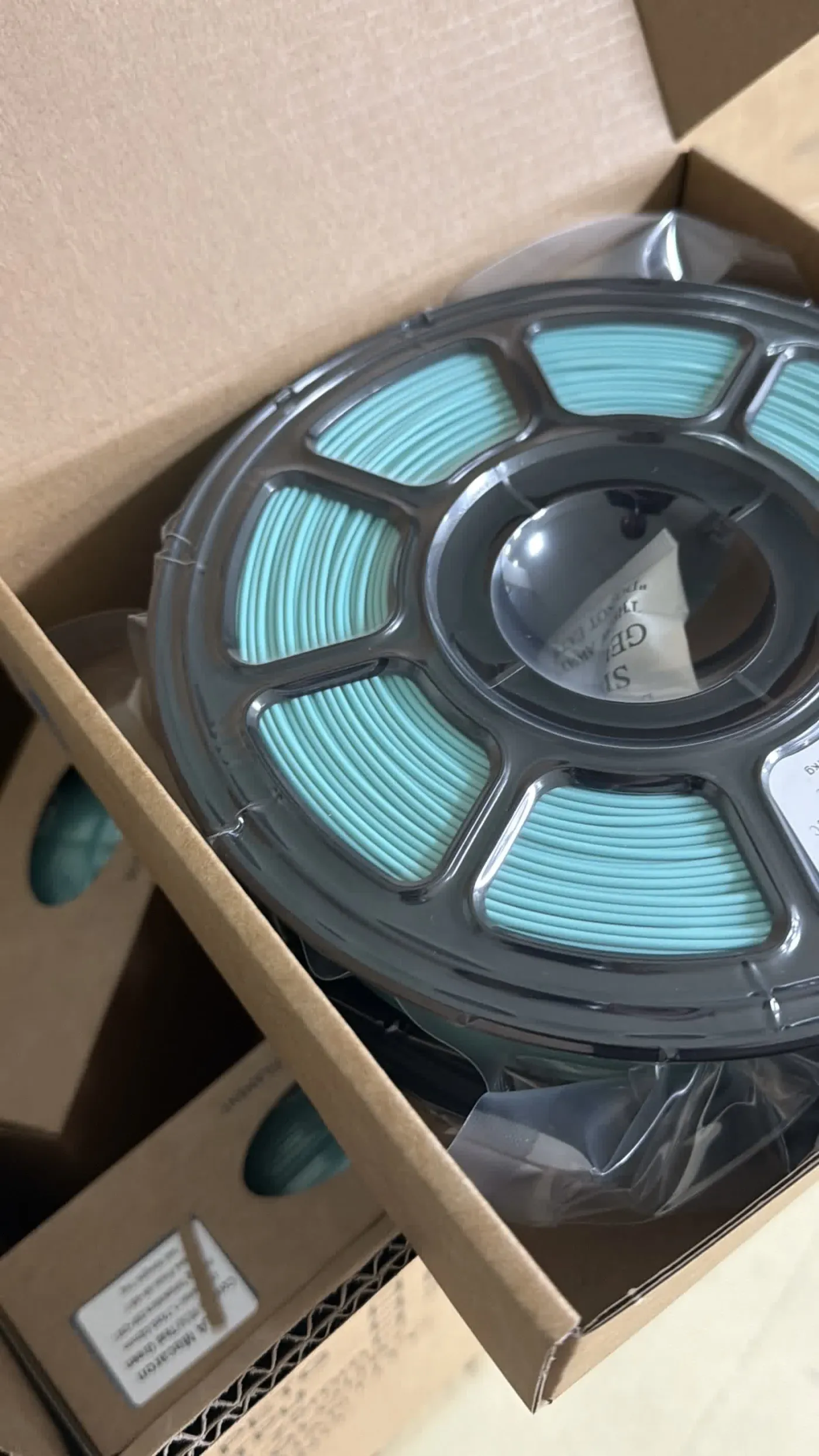 Finished filament spool packed in its individual box at the assessed partner