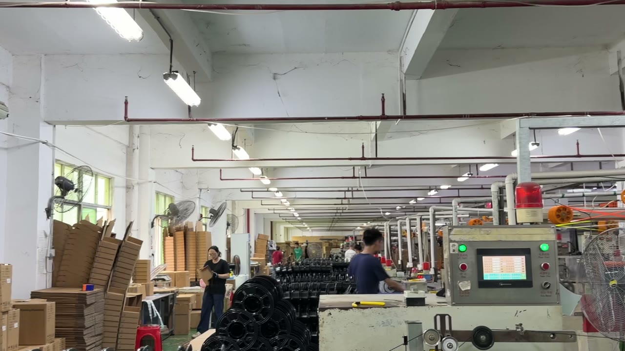 Filament manufacturing facility floor with finished spool pallets